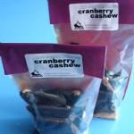 Find out more about '8 x 100g Dark Organic Chocolate with Cranberries and Cashews'